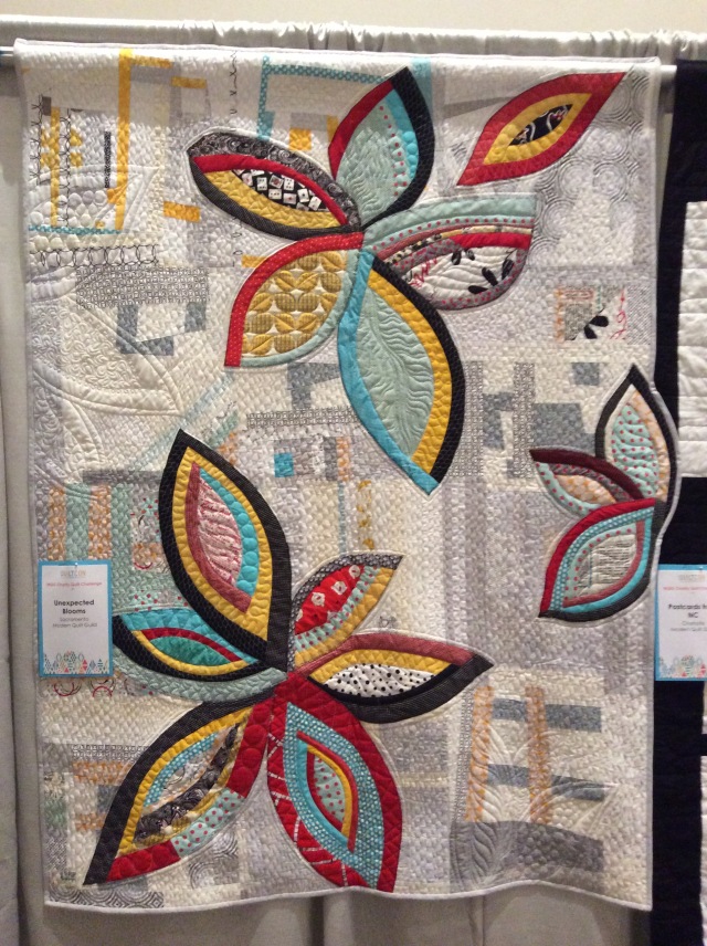 Unexpected Blooms by the Sacramento Modern Quilt Guild