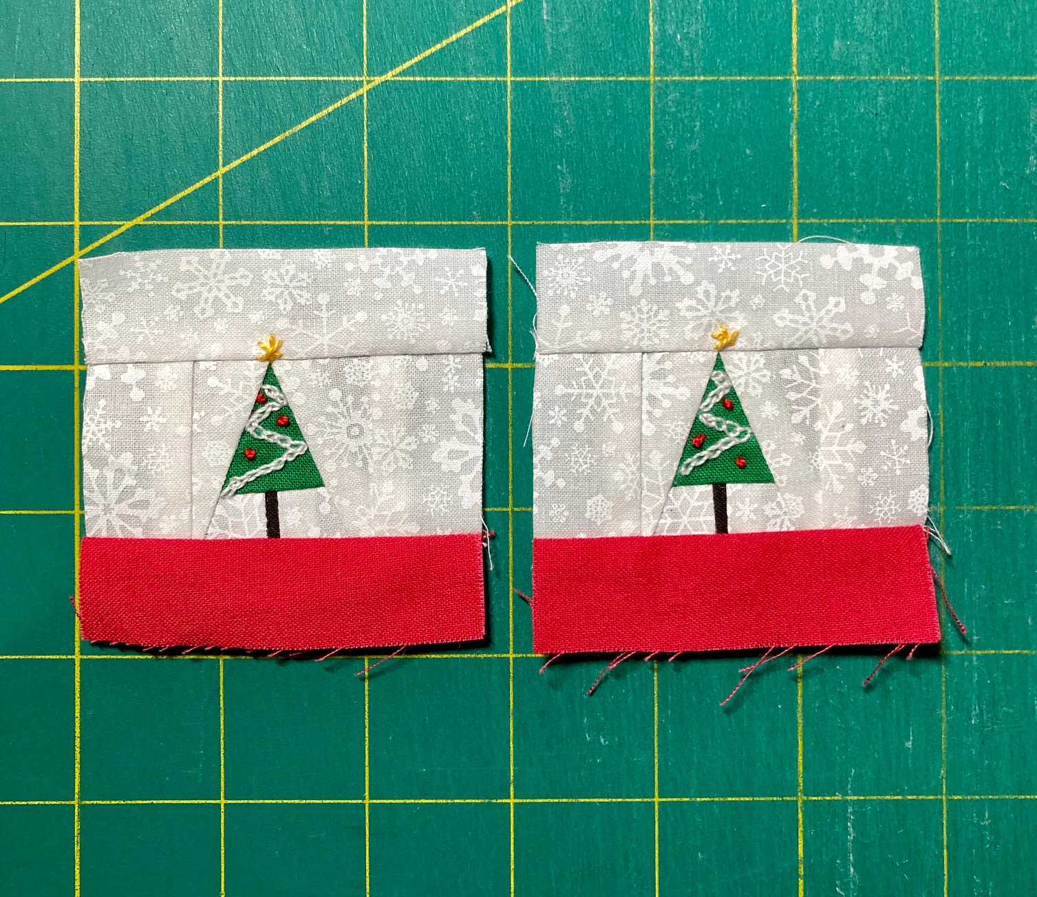 Two embellished sew tiny pine trees